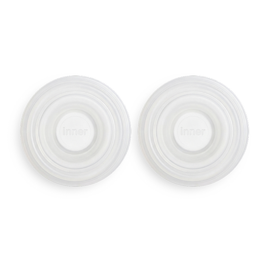 set of two white silicone diaphragms that are spare parts used in solyymoms air 1 breast pump
