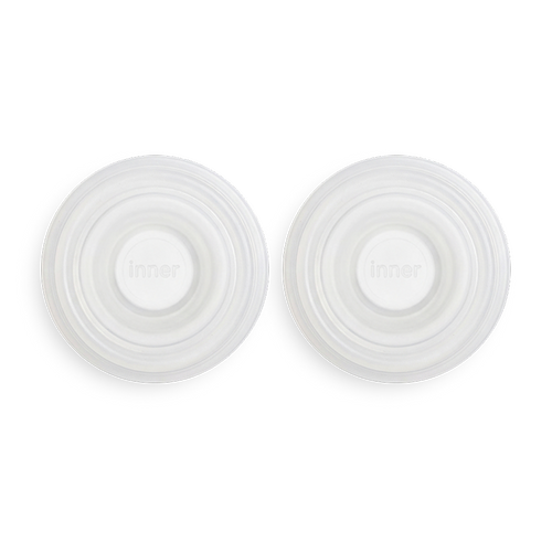 set of two white silicone diaphragms that are spare parts used in solyymoms air 1 breast pump