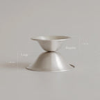 Two solyymoms silver nipple shields placed one above the other labeled 'Large' and 'Regular' on a light gray background