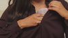 Solyymoms wearable breast pump with hospital-grade suction expressing milk into a baby bottle